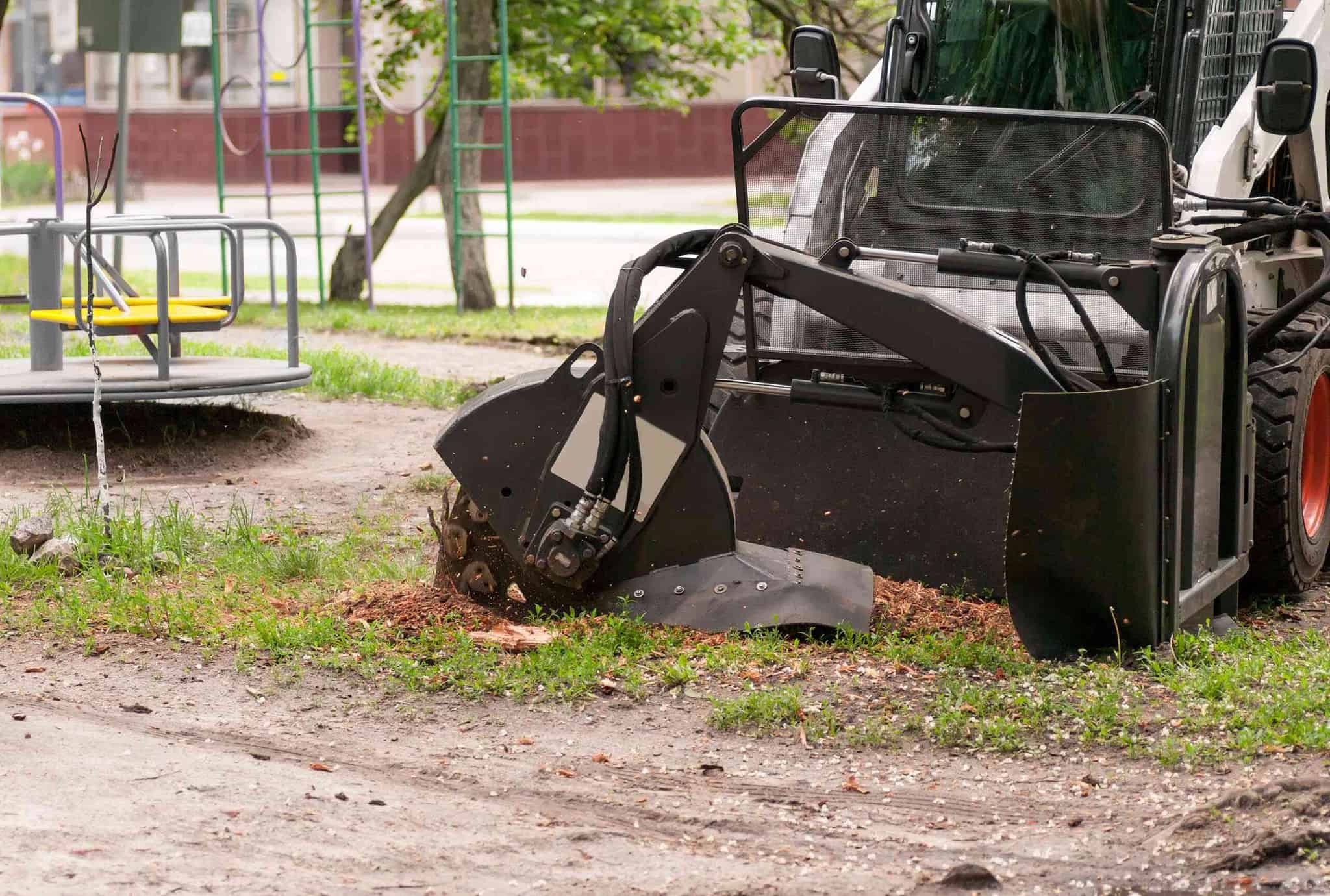 stump grinder being used at a park.